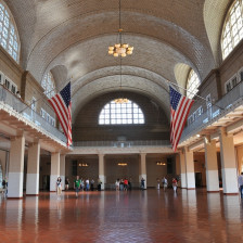 Visitors in the Registry Room of Ellis Island at the Statue of Liberty National Monument in New York City, New York