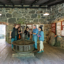 Travelers at one of the outdoor exhibits of the Hagley Museum and Library in Willmington, Delaware