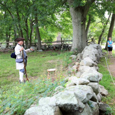 Guide telling visitors about the battles of Lexington and Concord at the Minute Man National Historical Park in Massachusetts