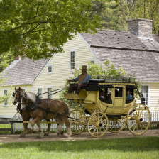 Horse-drawn carriage ride through Old Sturbridge Village in Massachusetts