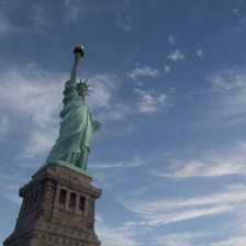 Guide telling visitors about the Statue of Liberty at the State of Liberty National Monument in New York City, New York