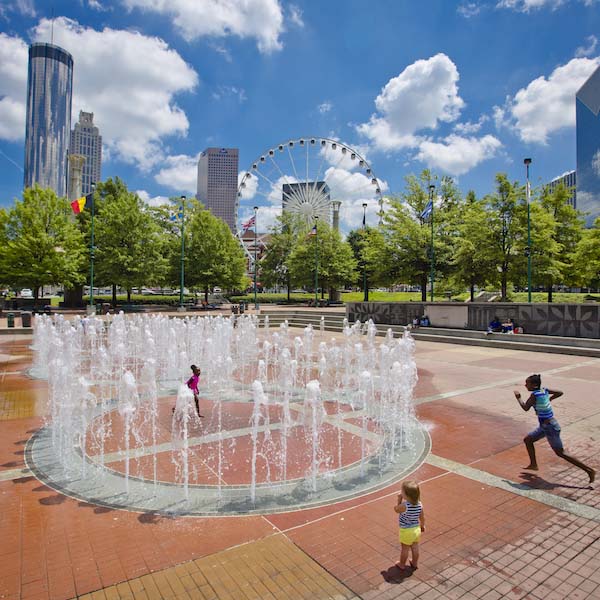 Children playing in the splash fountain of Centennial Olympic Park in Atlanta, Georgia