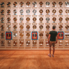 Visitor admiring the wall of records at the Country Music Hall of Fame in Nashville, Tennessee
