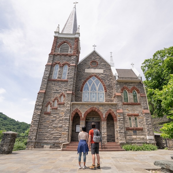 Visitors in front of St. Peter's Roman Catholic Church at the Hapers Ferry National Historical Park in West Virginia