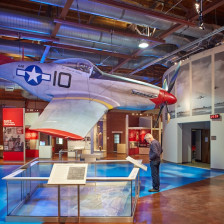 Visitor at a display in the museum at the Tuskegee Airmen National Historic Site in Tuskegee, Alabama
