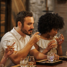People at a bourbon tasting at Castle & Key Distillery In Lexington, Kentucky, a stop on the Kentucky Bourbon Trail