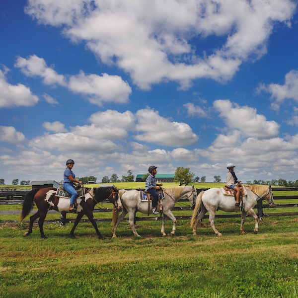 Visitors on a horseback ride at the Kentucky Horse Park in Lexington, Kentucky