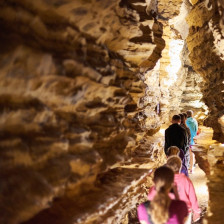 Visitors walking through a passage at Mark Twain Cave in Hannibal, Missouri
