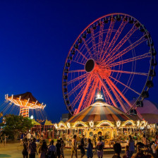 People enjoying the rides of Navy Pier at night in Chicago, Illinois