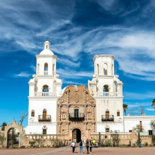 Visitors outside San Xavier del Bac Mission in Tucson, Arizona