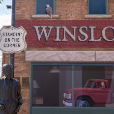 Statue and sign at Standin' on the Corner Park in Winslow, Arizona