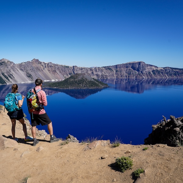 Hikers taking in the views at Crater Lake National Park in Oregon