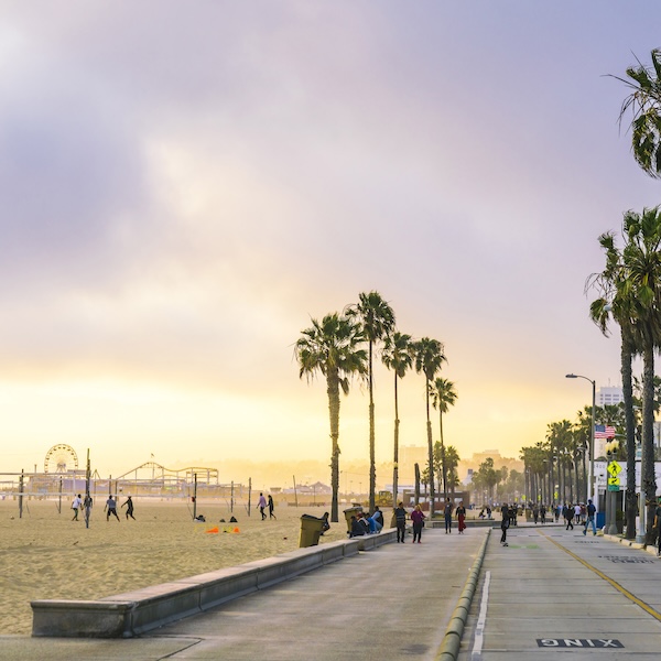 People walking along the Venice Beach Boardwalk in Los Angeles, California